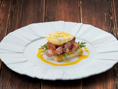 Eggs Benedict with bacon and hollandaise sauсe