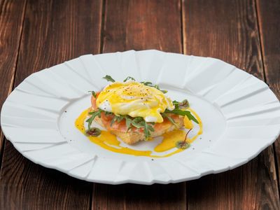 Eggs Benedict with salmon and hollandaise sauсe