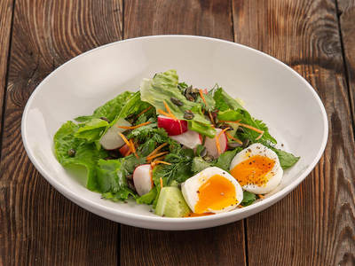 Village-style vegetable salad with egg and oil